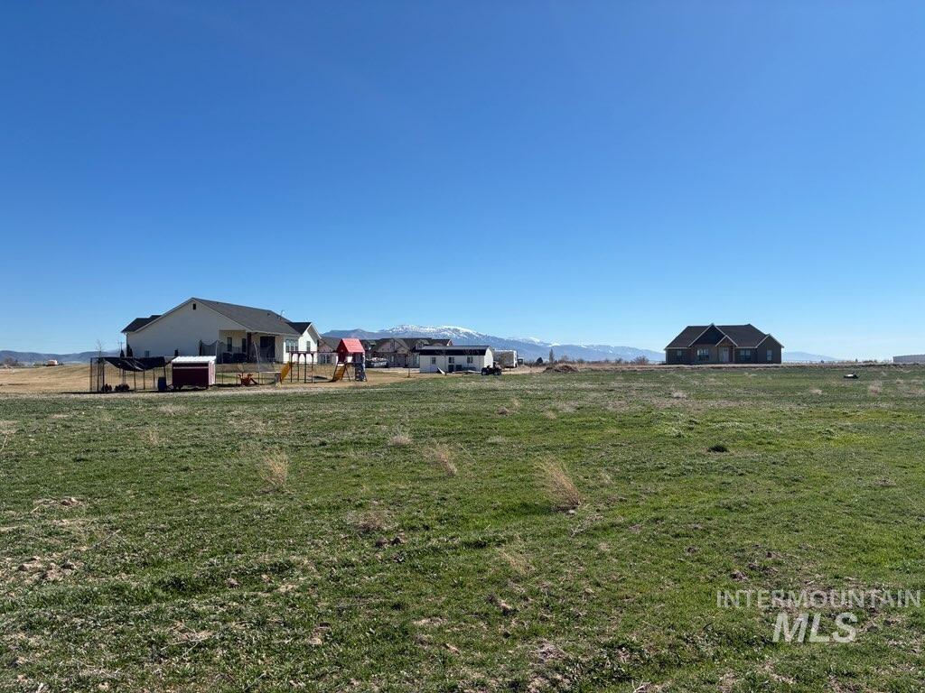 309 Ferdinand Circle Burley, ID 83318 - Photo 4 of 5 View of yard featuring a mountain view and a view of countryside