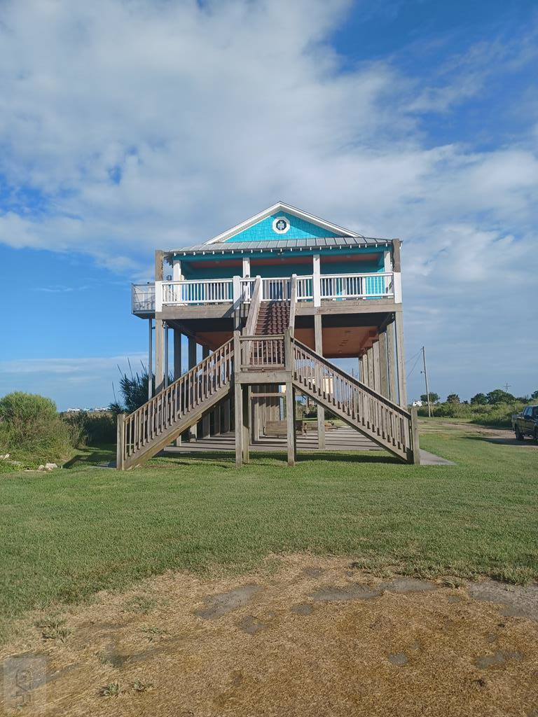 a view of a bedroom with big yard and large trees