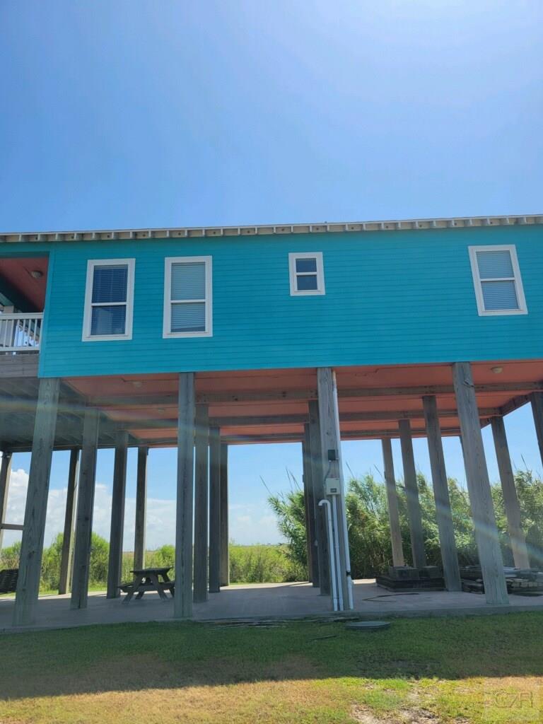1279 Faggards Road Port Bolivar, TX 77650 - Photo 2 of 16 a front view of a house with a yard