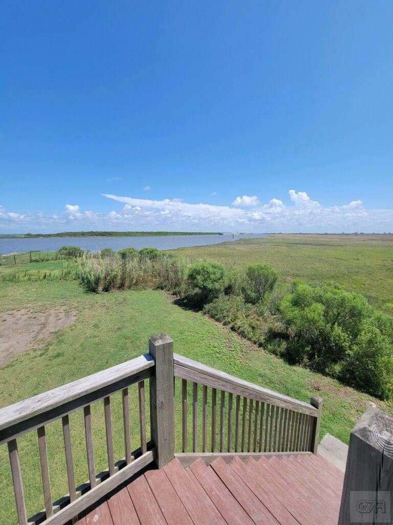 1279 Faggards Road Port Bolivar, TX 77650 - Photo 5 of 16 a view of a wooden deck with sunset view