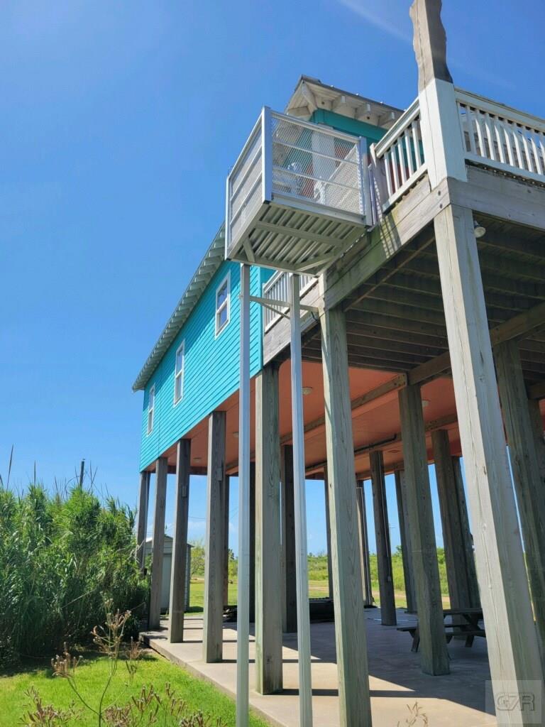 1279 Faggards Road Port Bolivar, TX 77650 - Photo 6 of 16 a front view of a building with garden