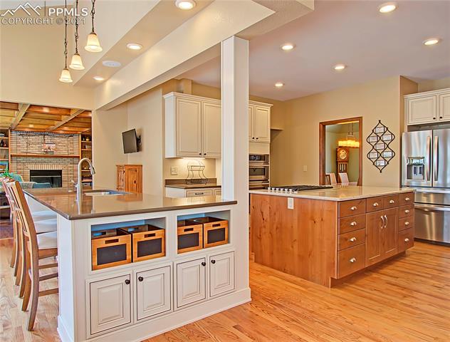 735 Winding Hills Road Monument, CO 80132 - Photo 11 of 42 Kitchen is open and spacious and open to the living room.