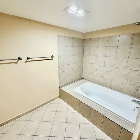 a bathroom with a sink and a shower