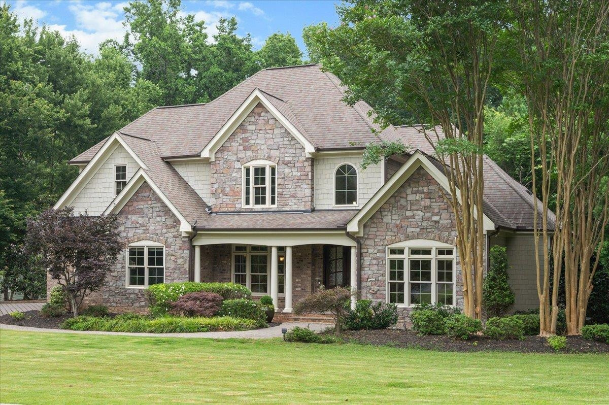 8420 Norman Estates Way Raleigh, NC 27613 - Photo 4 of 45 a front view of a house with a yard