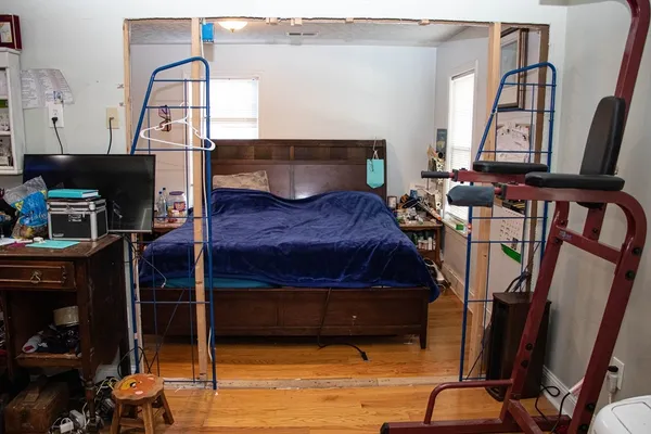a bedroom with furniture and a window
