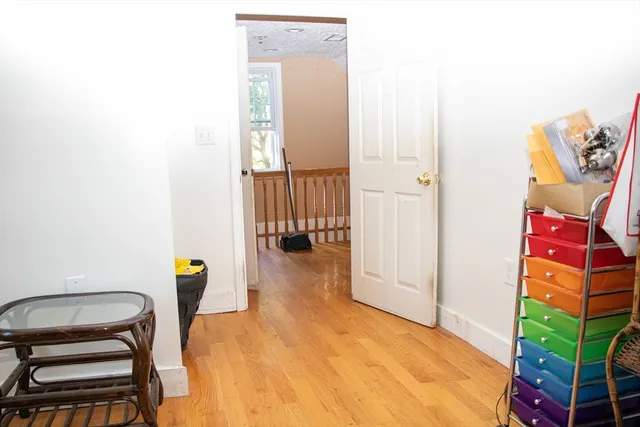 a view of hallway with seating area