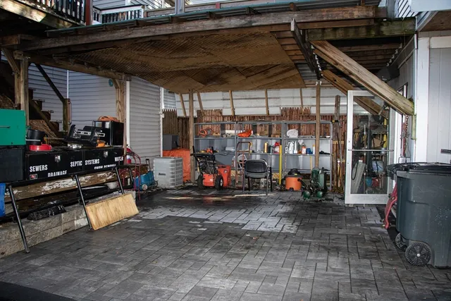 a view of a garage with a table and chairs