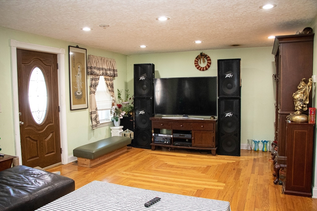 20 Washburn Street Worcester, MA 01610 - Photo 6 of 40 a living room with furniture and a flat screen tv