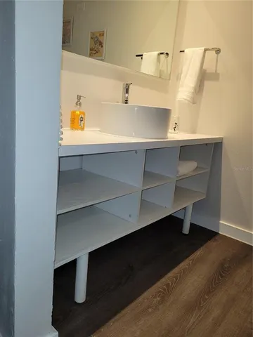 a bathroom with a sink and a mirror