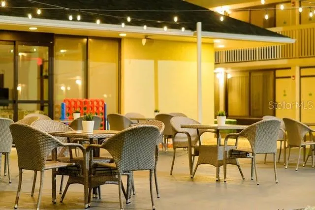 a patio with a patio table and chairs