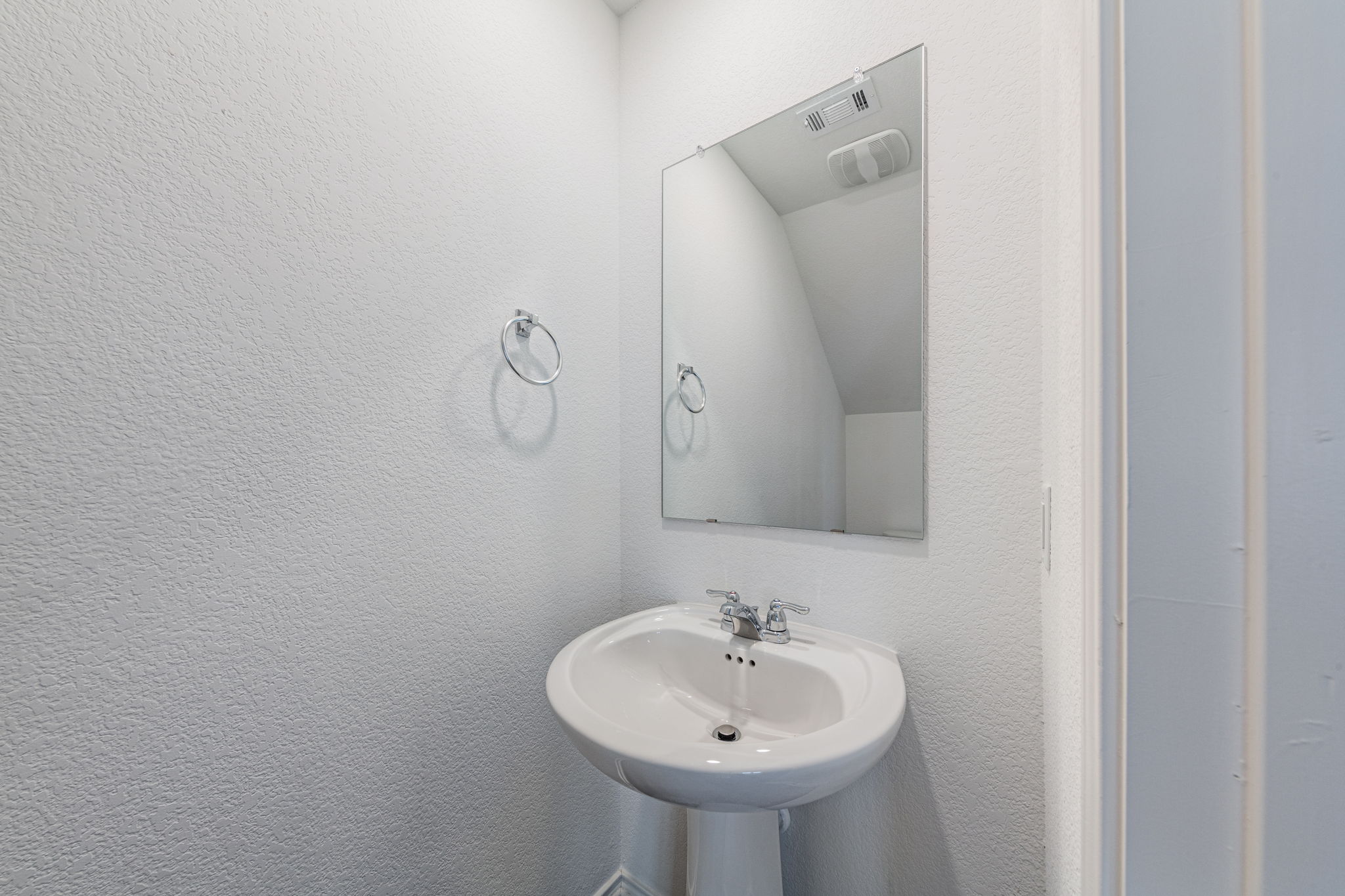 252 Patagonia Kyle, TX 78640 - Photo 15 of 30 a bathroom with a sink and a mirror