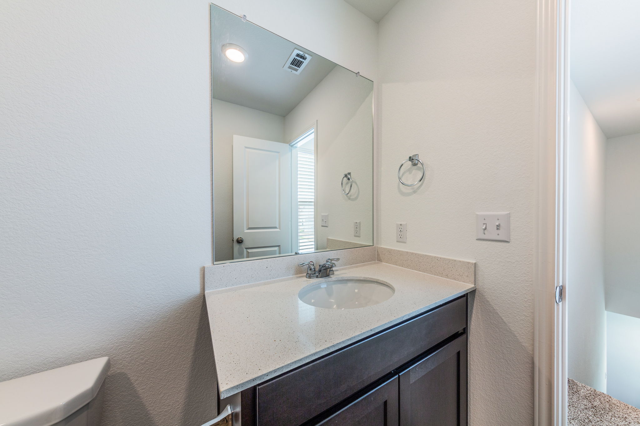 252 Patagonia Kyle, TX 78640 - Photo 17 of 30 a bathroom with a sink a toilet and a mirror