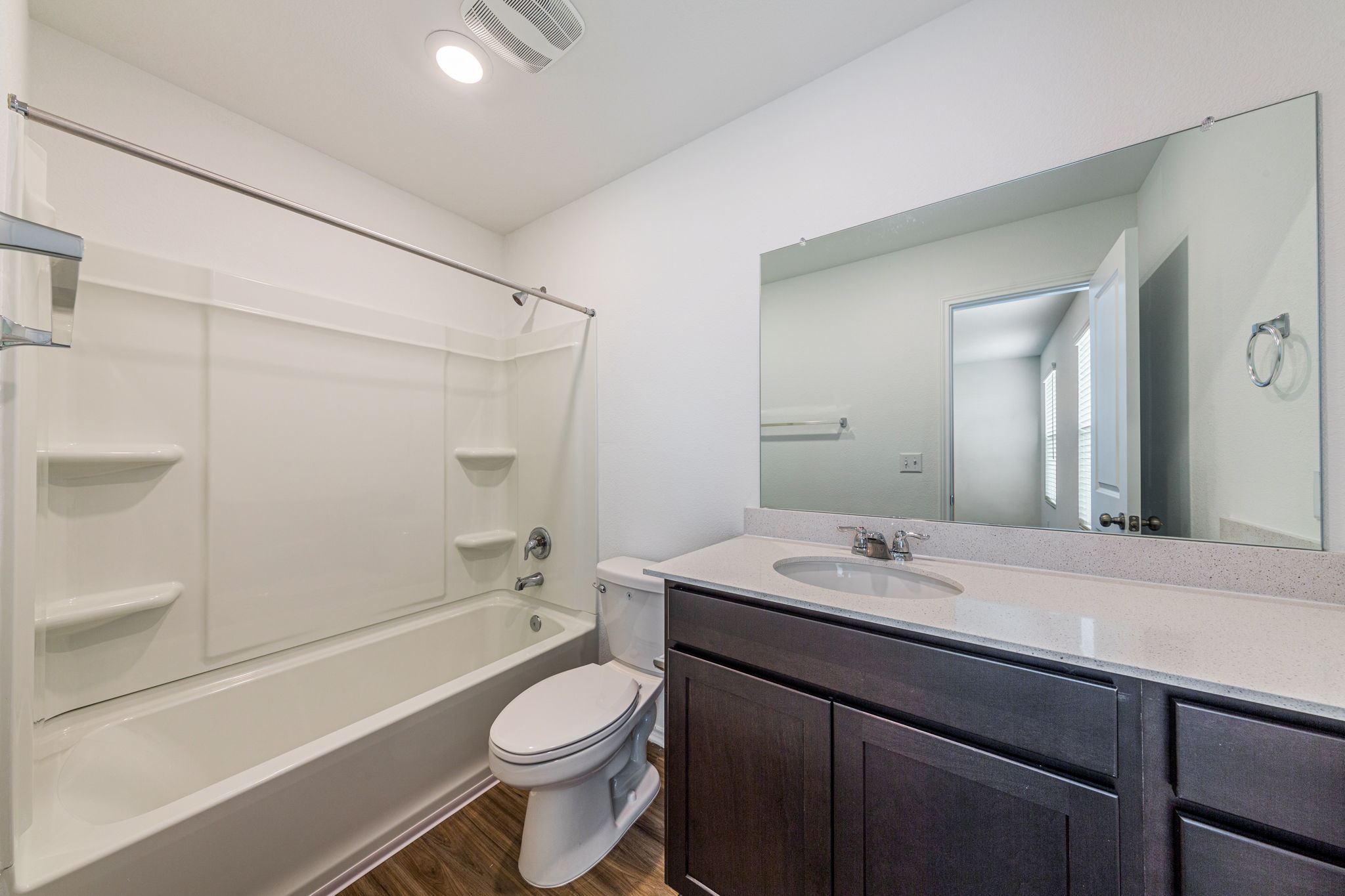252 Patagonia Kyle, TX 78640 - Photo 23 of 30 a bathroom with a sink a toilet and shower