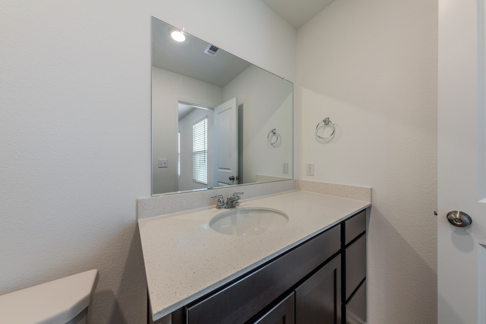252 Patagonia Kyle, TX 78640 - Photo 24 of 30 a bathroom with a sink vanity and a toilet