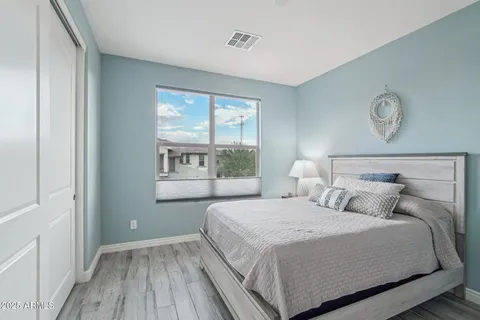 a bedroom with a bed and a window