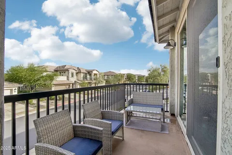 a balcony with furniture and city view