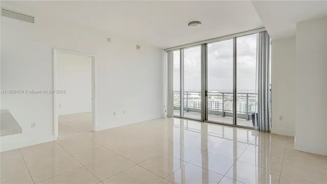 a view of an empty room and window