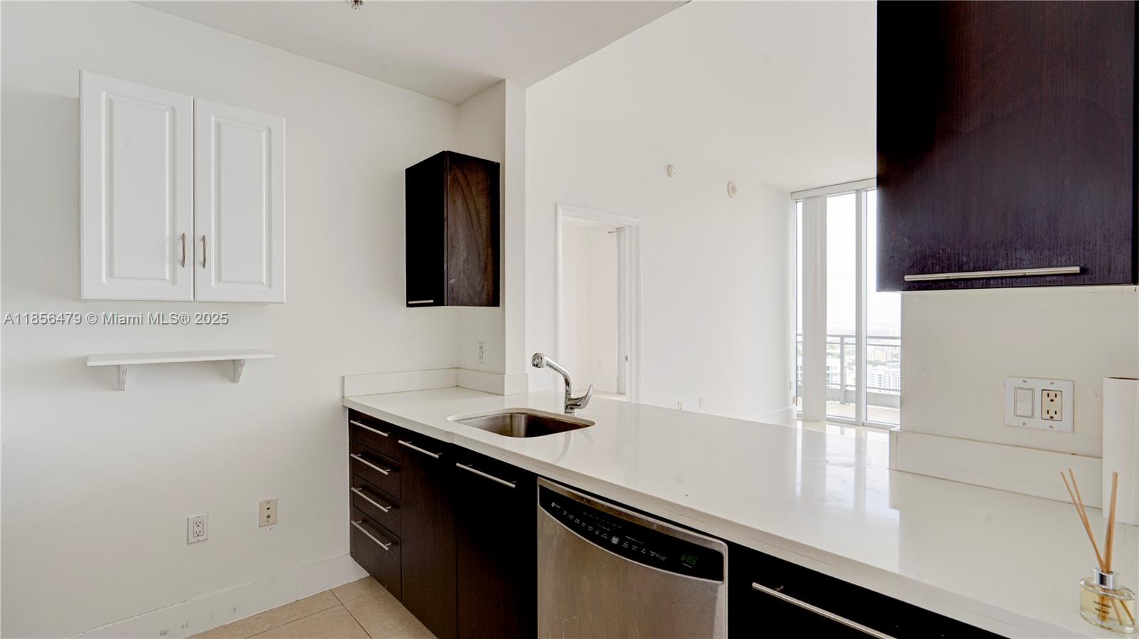 90 Southwest 3rd Street, Unit PH10 Miami, FL 33130 - Photo 7 of 23 a close view of a sink and a mirror in a room