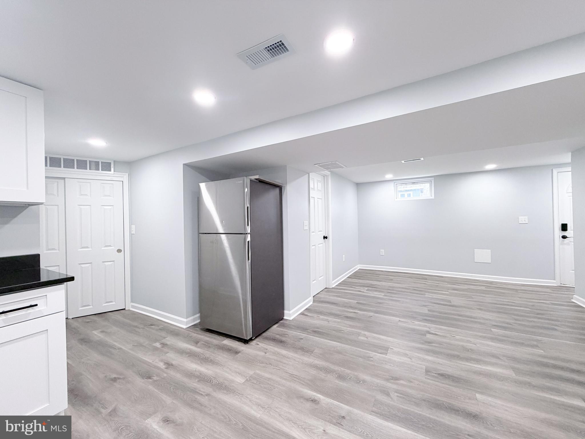 4902 91st Place Lanham, MD 20706 - Photo 27 of 30 a view of empty room with wooden floor