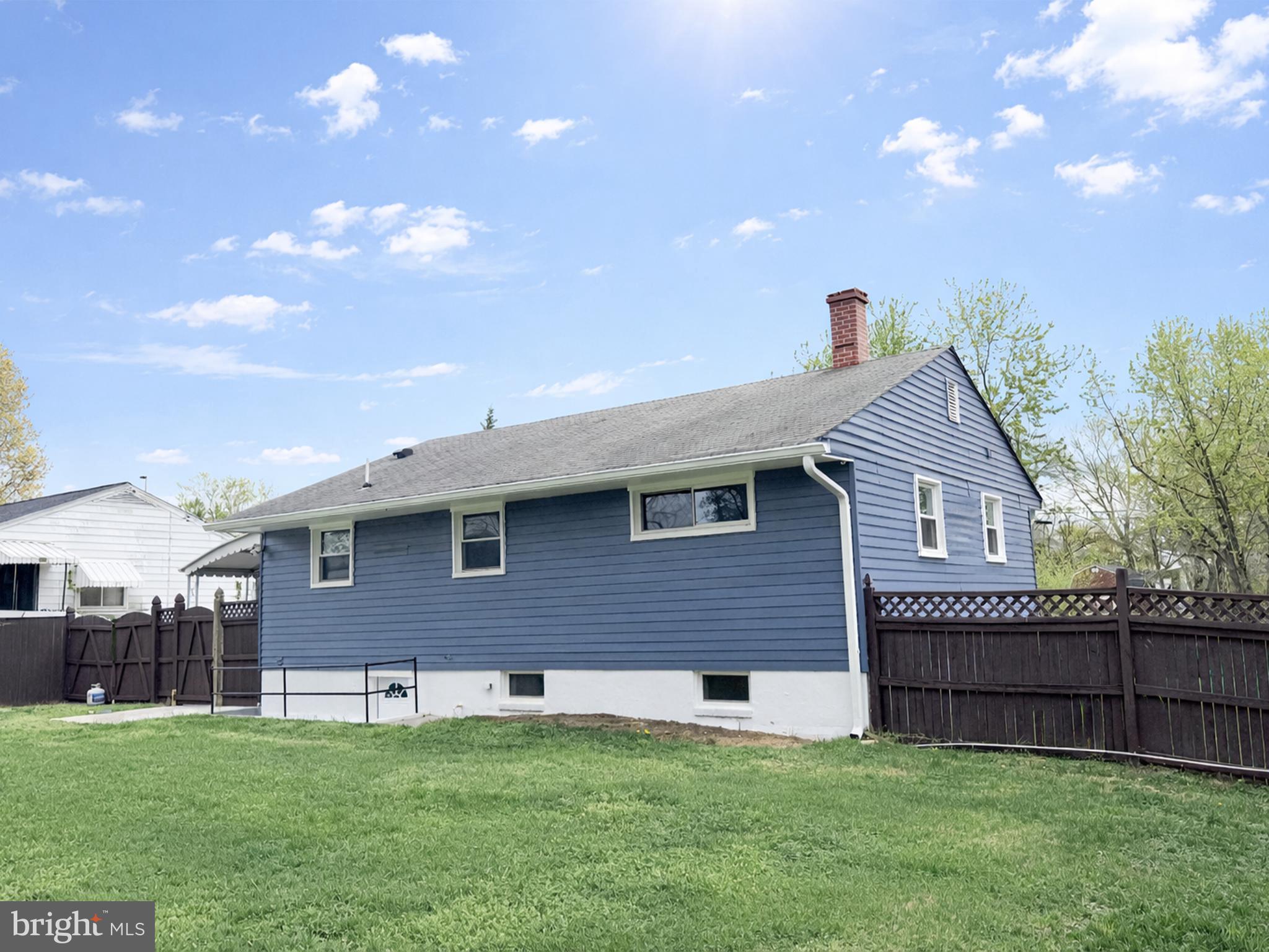 4902 91st Place Lanham, MD 20706 - Photo 5 of 30 a front view of a house with a garden