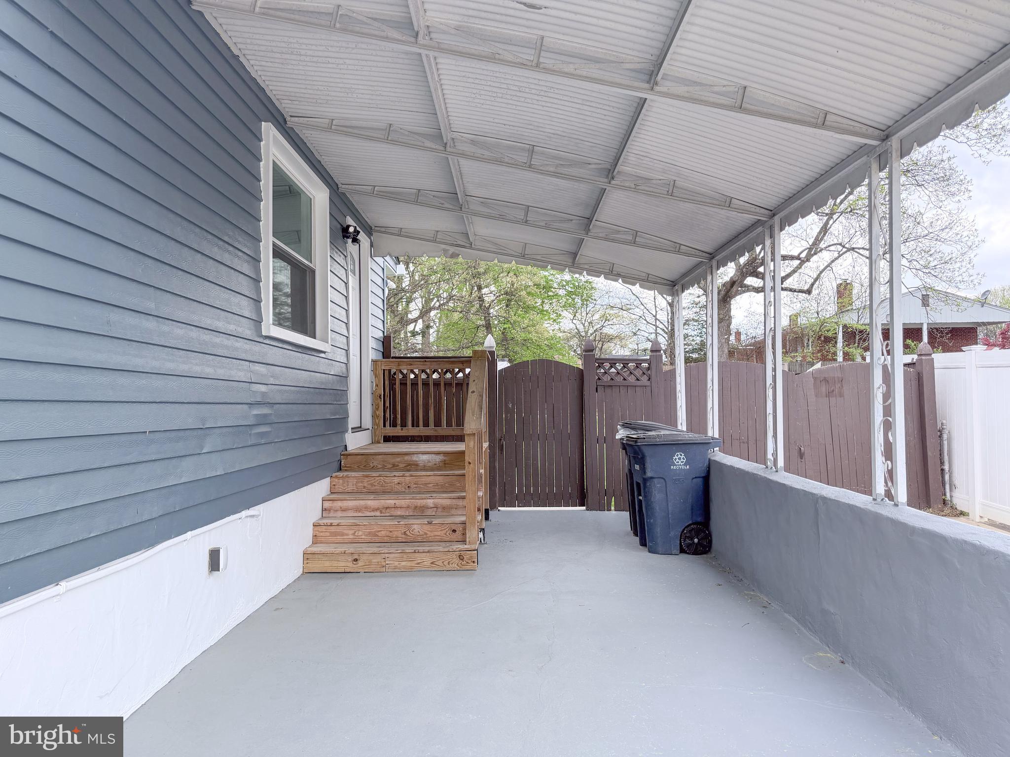4902 91st Place Lanham, MD 20706 - Photo 8 of 30 a view of backyard with porch and outdoor seating