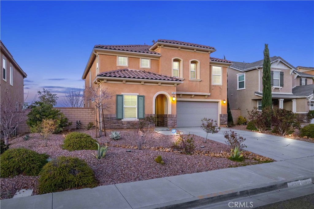 2831 Wandoo Road Palmdale, CA 93551 - Photo 1 of 1 a front view of a house with garden
