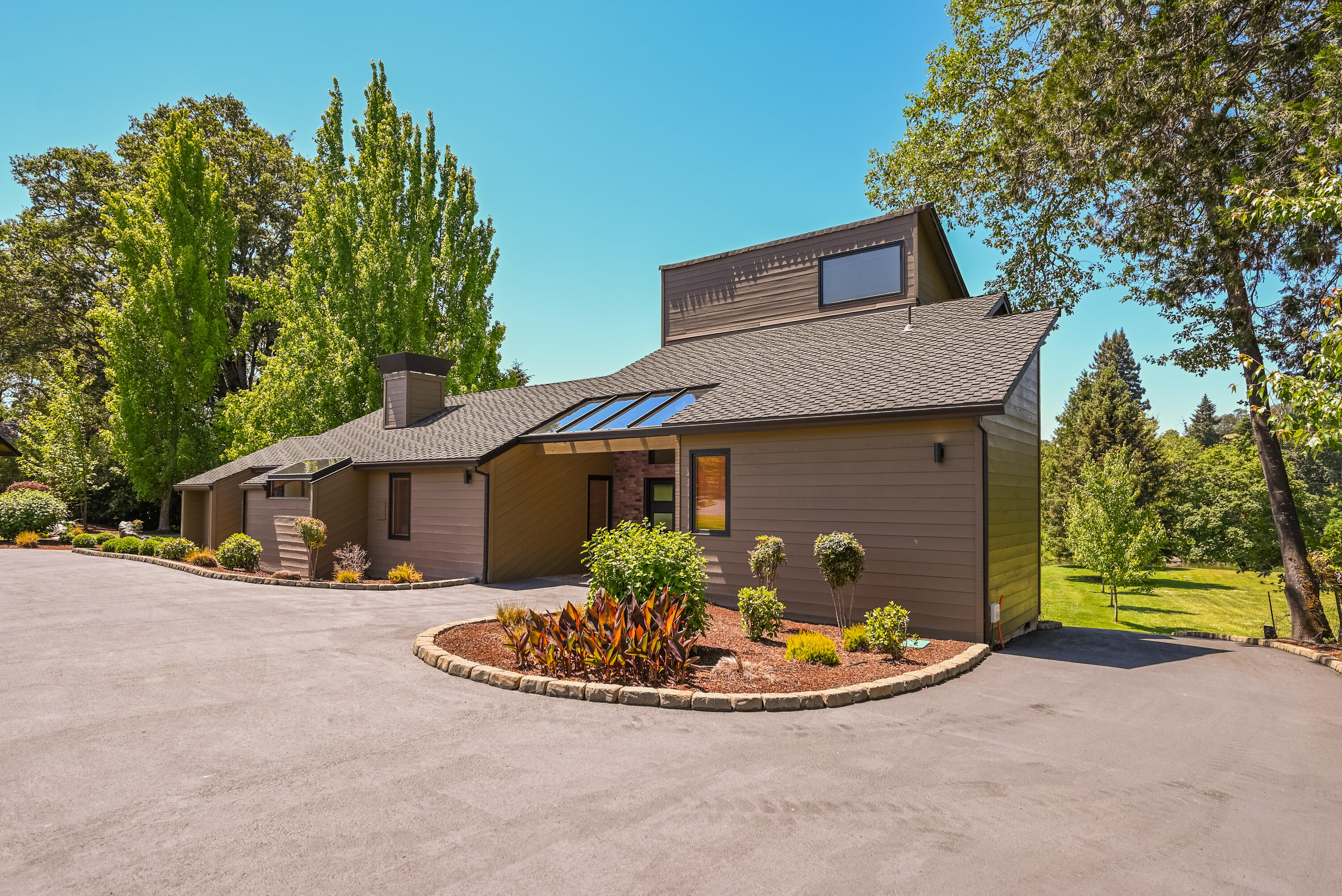 2546 Fisher Road Roseburg, OR 97471 - Photo 2 of 59 a view of a house with a small yard and potted plants