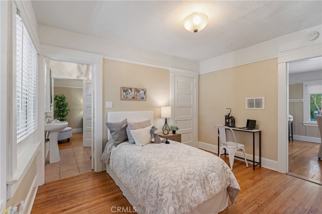 846 North Wilson Avenue Pasadena, CA 91104 - Photo 17 of 37 a bedroom with a bed and wooden floor