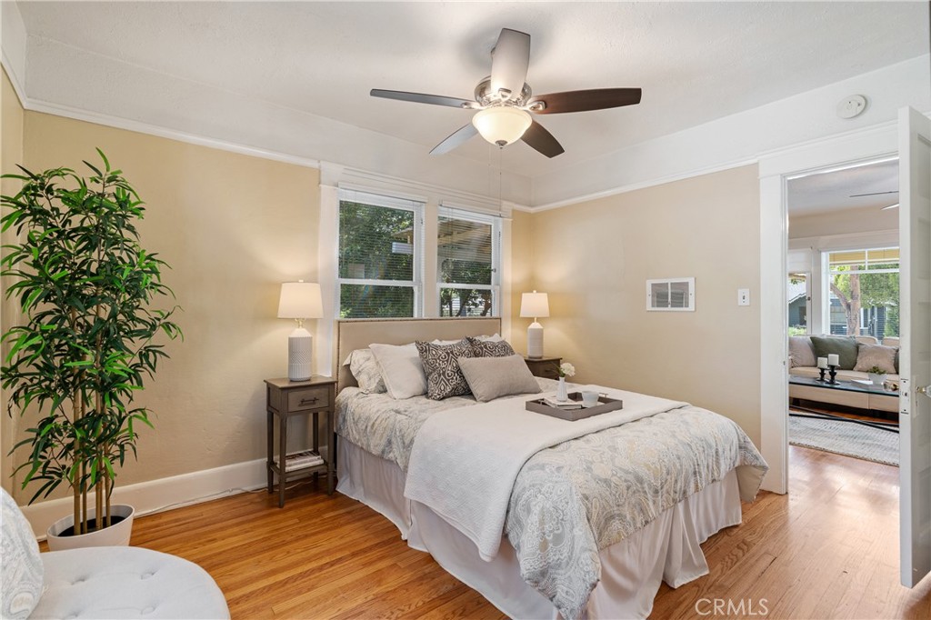846 North Wilson Avenue Pasadena, CA 91104 - Photo 20 of 37 a bedroom with a large bed chandelier and a window