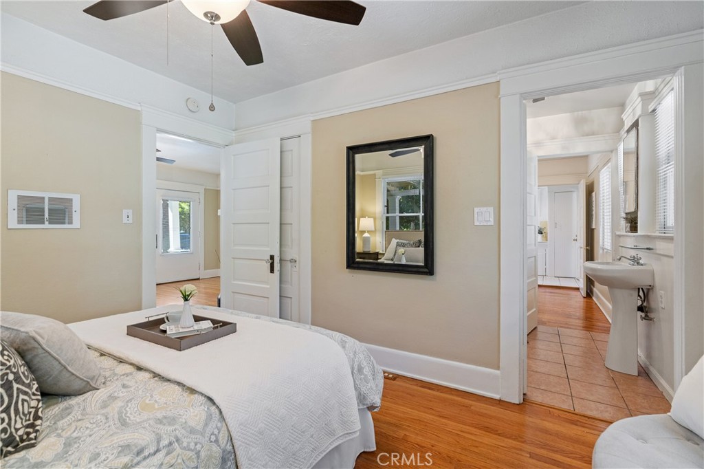 846 North Wilson Avenue Pasadena, CA 91104 - Photo 22 of 37 a bedroom that has a bed and a table in it