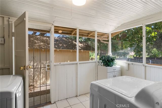 a room with a table and chairs