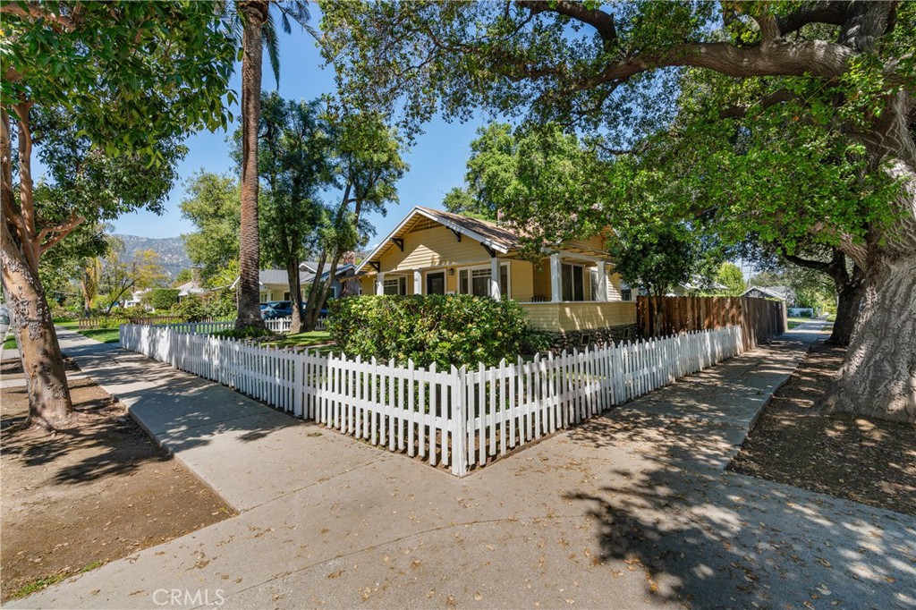 846 North Wilson Avenue Pasadena, CA 91104 - Photo 35 of 37 a view of a house with a small yard and large trees