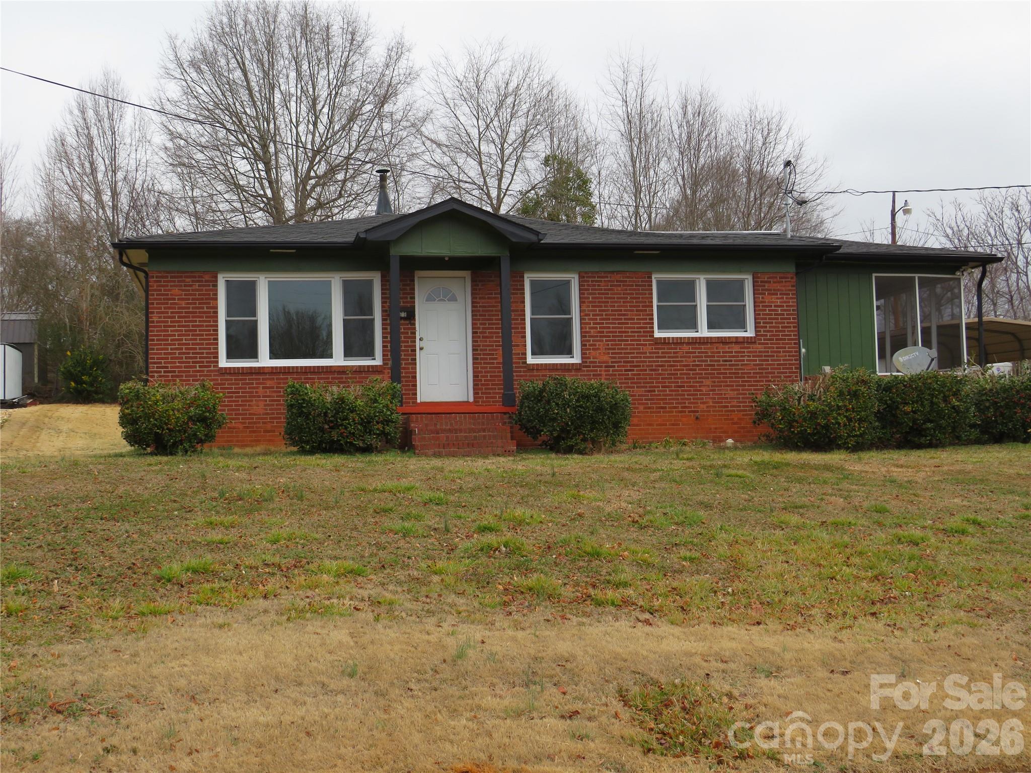 274 Georgia Street Spindale, NC 28160 - Photo 1 of 25 a front view of a house with garden