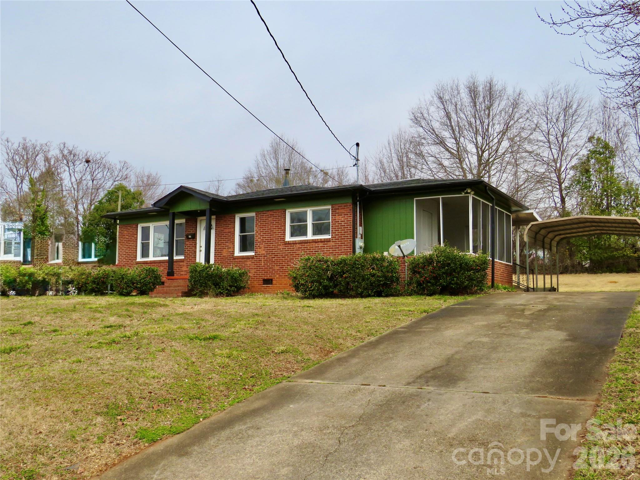 274 Georgia Street Spindale, NC 28160 - Photo 24 of 25 a front view of a house with a yard