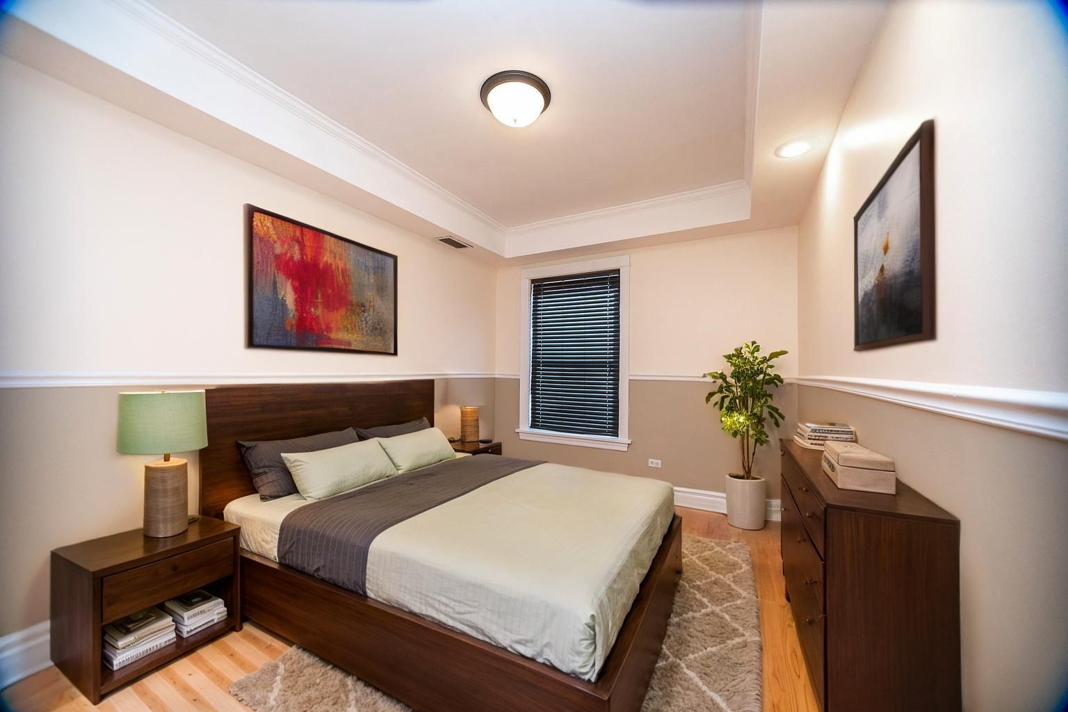 3737 North Pulaski Road, Unit 2S Chicago, IL 60641 - Photo 12 of 33 a bedroom with a bed and a couch