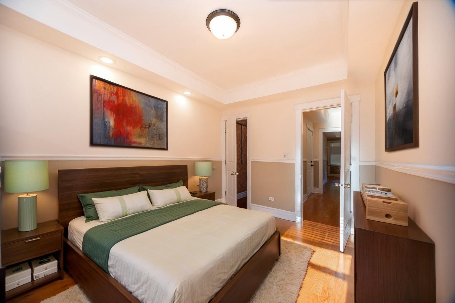 3737 North Pulaski Road, Unit 2S Chicago, IL 60641 - Photo 14 of 33 a bedroom with a bed and a lamp