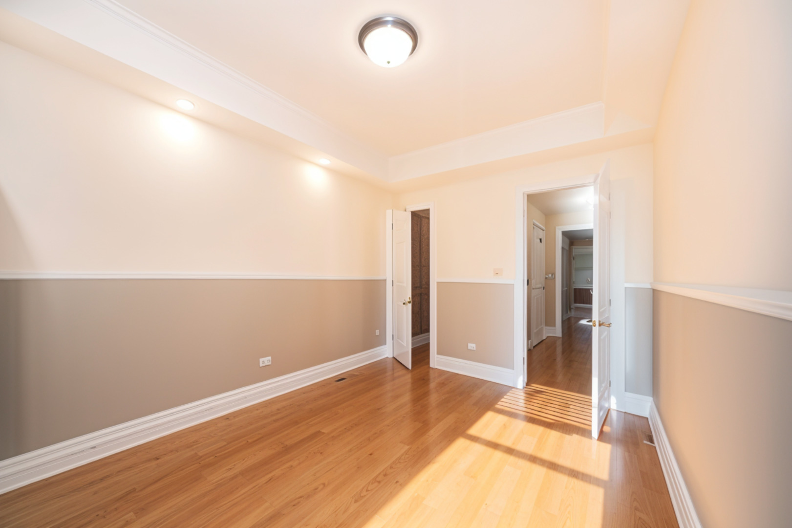 3737 North Pulaski Road, Unit 2S Chicago, IL 60641 - Photo 15 of 33 an empty room with wooden floor and windows