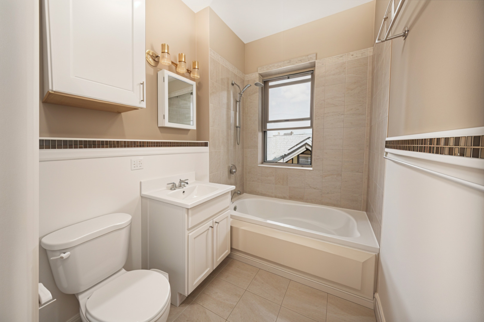 3737 North Pulaski Road, Unit 2S Chicago, IL 60641 - Photo 17 of 33 a bathroom with a sink a toilet and a bathtub