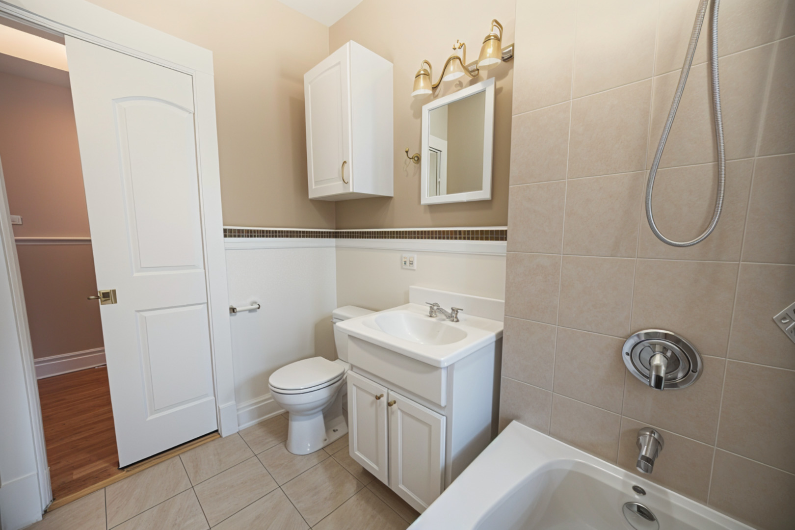 3737 North Pulaski Road, Unit 2S Chicago, IL 60641 - Photo 18 of 33 a bathroom with a sink toilet and vanity