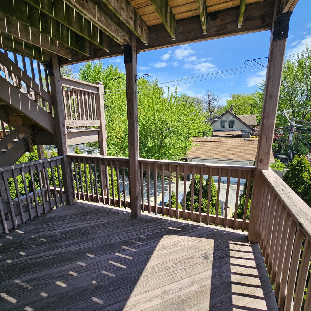 3737 North Pulaski Road, Unit 2S Chicago, IL 60641 - Photo 25 of 33 a view of a balcony with wooden floor