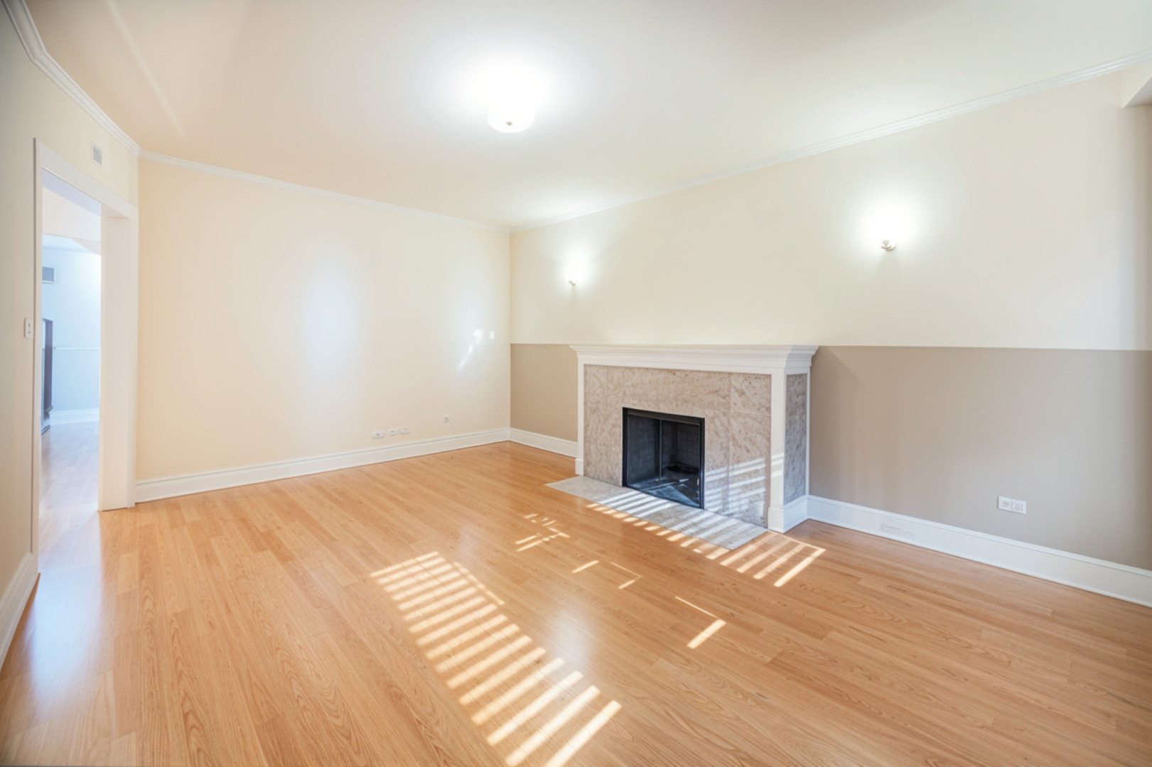 3737 North Pulaski Road, Unit 2S Chicago, IL 60641 - Photo 4 of 33 a view of empty room with wooden floor and fireplace