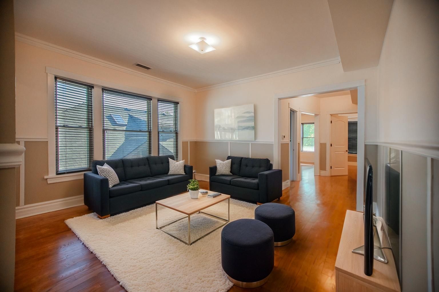 3737 North Pulaski Road, Unit 2S Chicago, IL 60641 - Photo 10 of 33 a living room with furniture rug and wooden floor