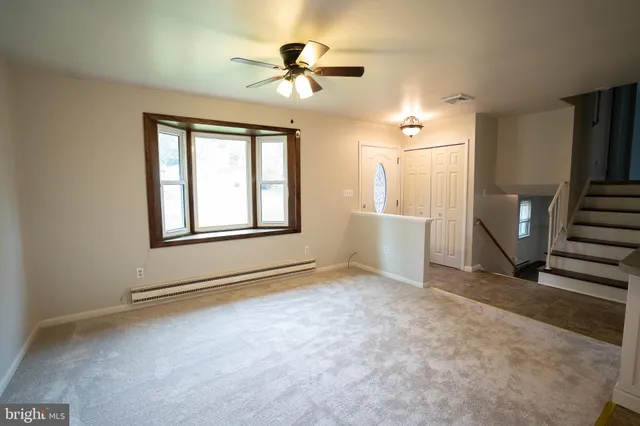 a view of an empty room with a window