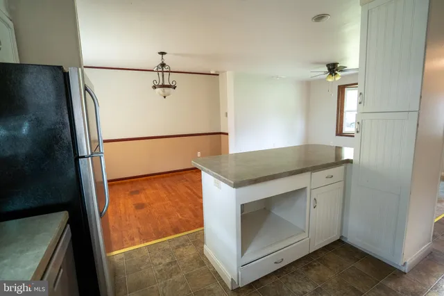 a kitchen with a sink and a refrigerator