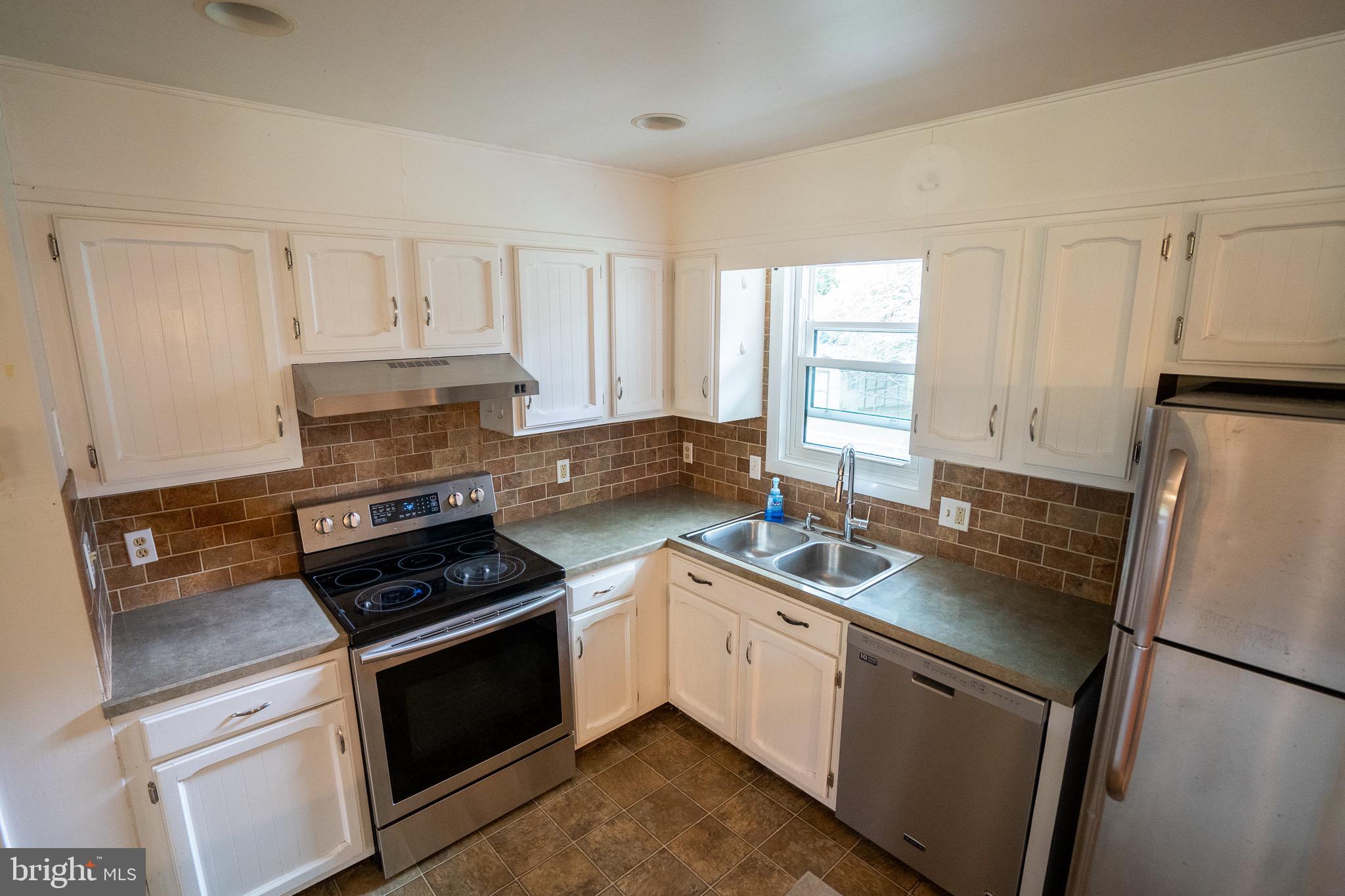 8 Sherri Lane Lititz, PA 17543 - Photo 17 of 43 a kitchen with a refrigerator stove and sink