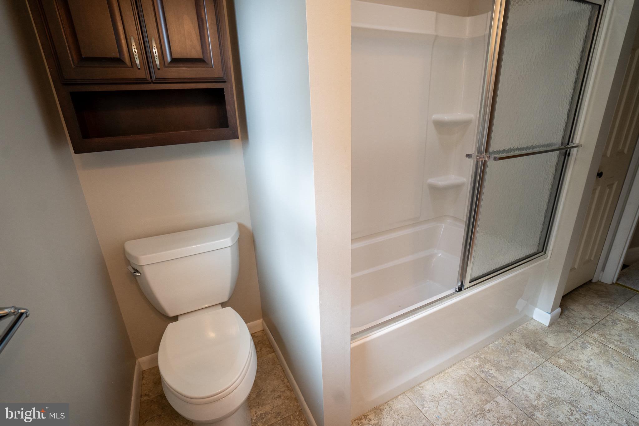 8 Sherri Lane Lititz, PA 17543 - Photo 25 of 43 a white toilet sitting next to a bathroom sink