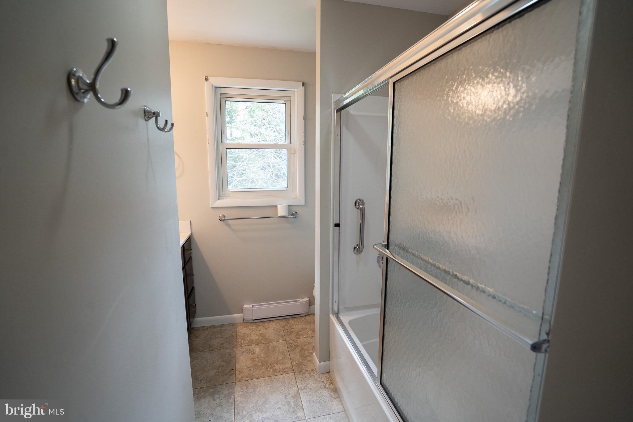 8 Sherri Lane Lititz, PA 17543 - Photo 26 of 43 a bathroom with a glass shower door