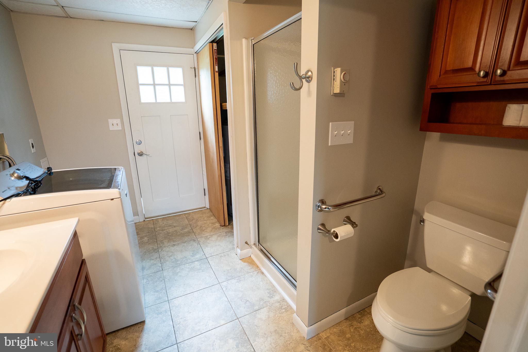 8 Sherri Lane Lititz, PA 17543 - Photo 31 of 43 a bathroom with a sink a toilet and shower