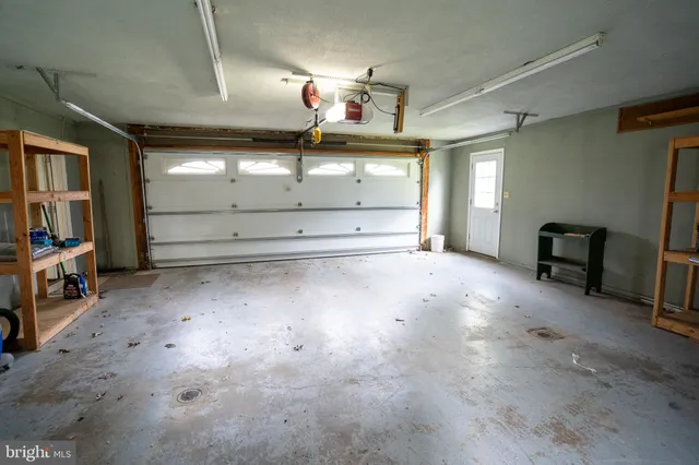a view of a livingroom with furniture and a window