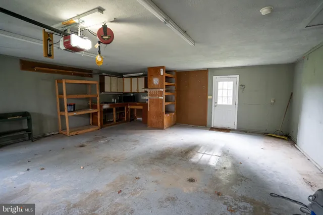 a view of a livingroom with a ceiling fan and window